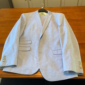 Paisley & Gray suit. Coat size 42r, pants size 34x32. Blue herringbone pattern.